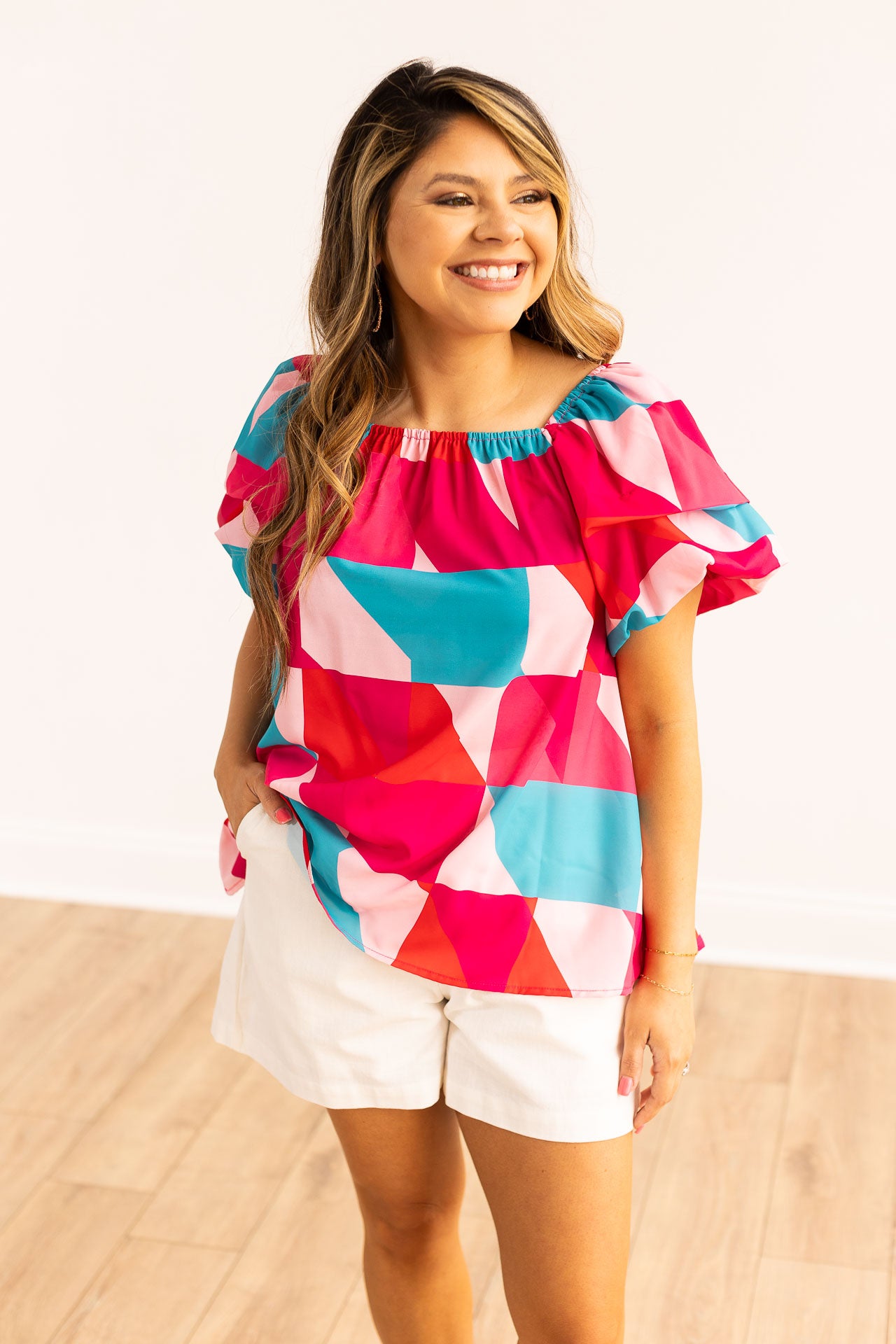 The Faelan Puff sleeve top with a multicolor print