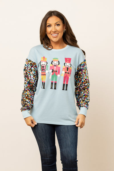 Nutcrackers on Blue Sweatshirt with Sequin Sleeves