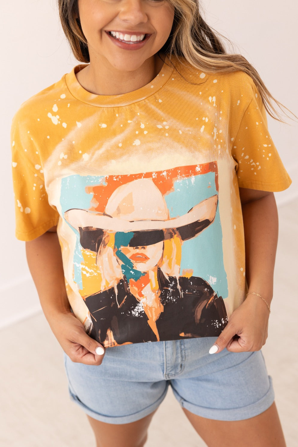 Cowgirl Art on Mustard Splatter Tee