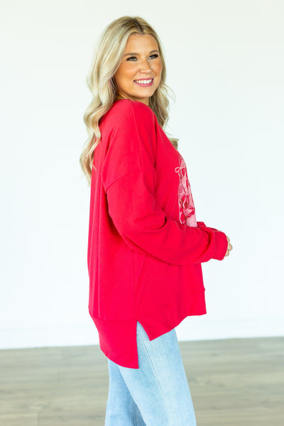 Kiss Cake on Red Sweatshirt