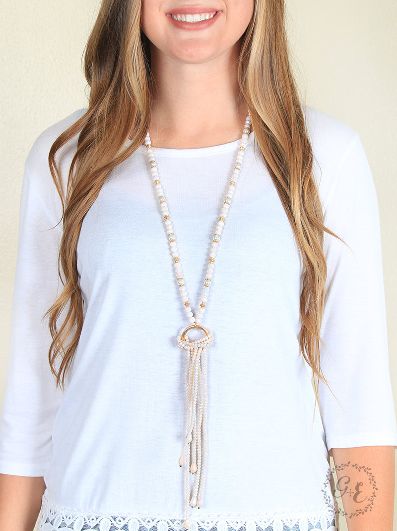 Elegant Ivory Beaded Tassel Necklace with Gold Ring Accent