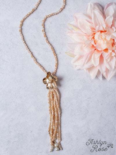 IMPRESS ME GOLD FLOWER TASSEL PENDANT ON A ROSY TAN CRYSTAL BEADED NECKLACE