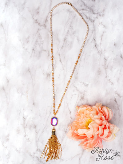 WATCH THE SUNSET WITH ME IRIDESCENT PENDANT WITH GOLD CHAIN TASSELS ON A MIXED CRYSTAL BEADED NECKLACE, WHITE