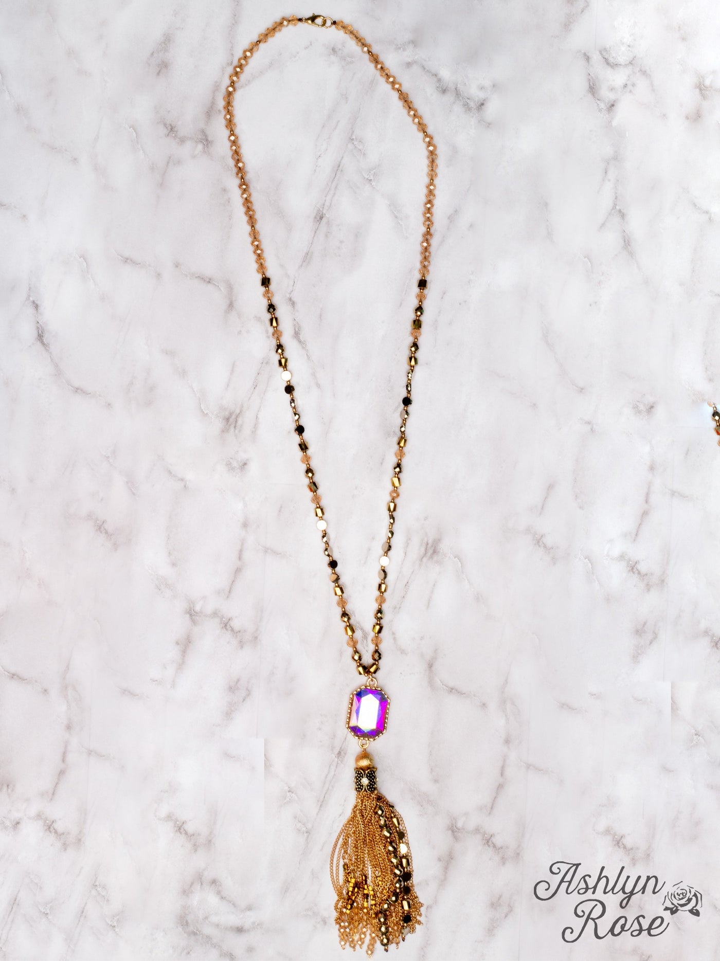 WATCH THE SUNSET WITH ME IRIDESCENT PENDANT WITH GOLD CHAIN TASSELS ON A MIXED CRYSTAL BEADED NECKLACE, BROWN