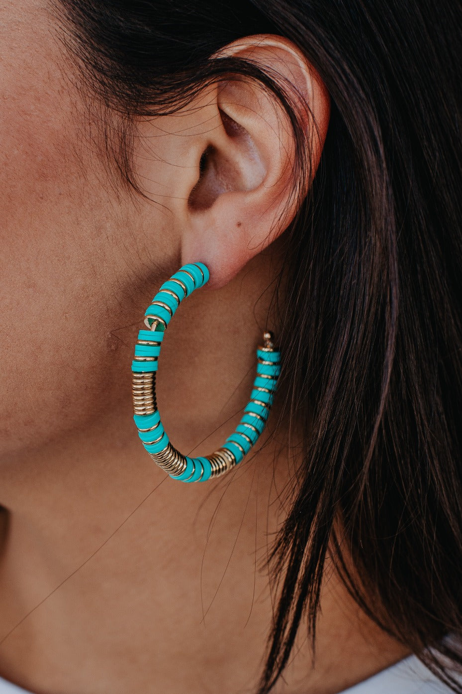 Take me to Bali Turquoise with gold hoop earrings