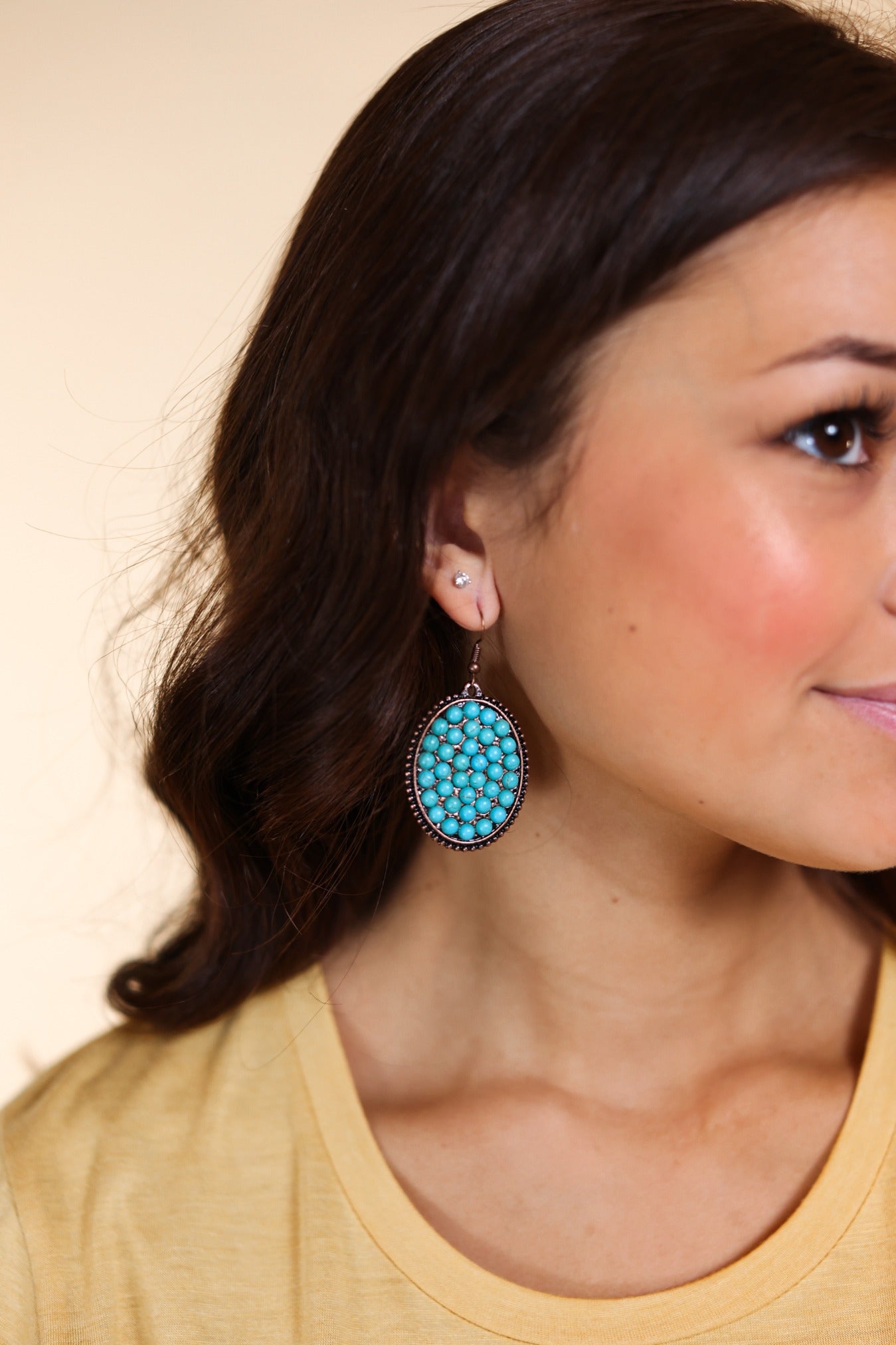 Bumpily Bamboozled Bronze Earrings With A Turquoise Pendant