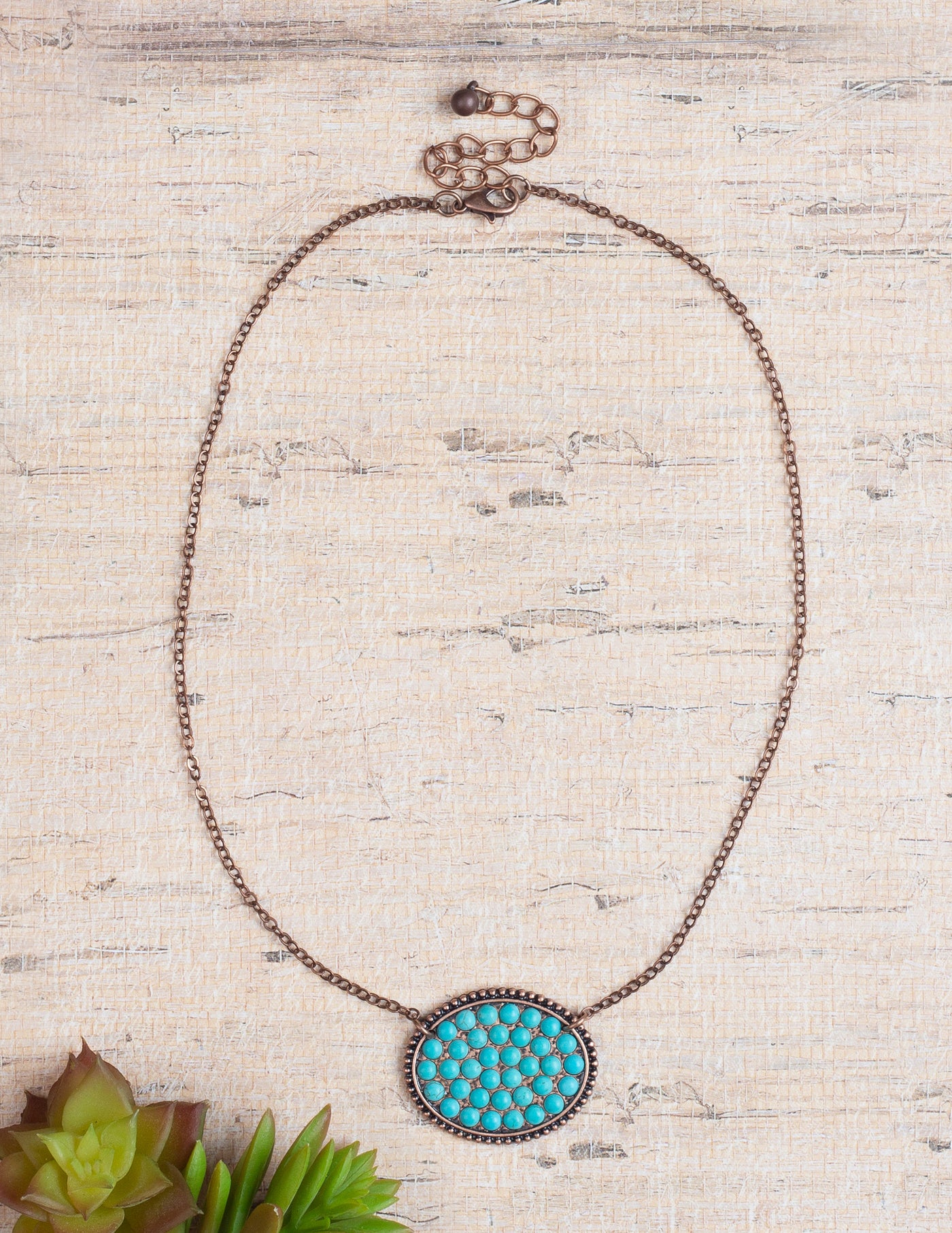 Bumpily Bamboozled Bronze Necklace With A Turquoise Pendant